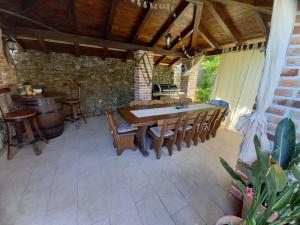 a dining room with a table and some chairs at Apartmani Dijana in Rab