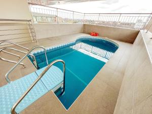 a swimming pool on the top of a building at The Gibs Hotel Limited in Port Harcourt