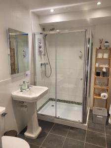 a bathroom with a shower and a sink at Scooniehill Farm House B&B in St. Andrews