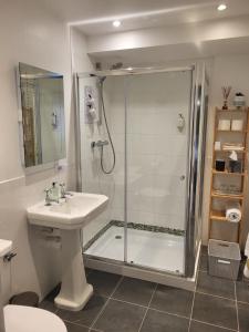a bathroom with a shower and a sink at Scooniehill Farm House B&B in St Andrews