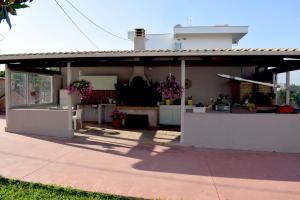 a house with a kitchen and a patio at Κτήμα Κωνσταντινίδη in Preveza