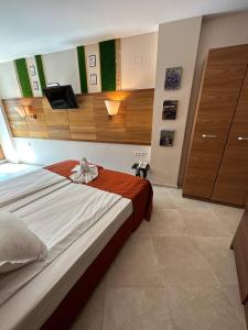 A bed or beds in a room at Briz Beach apartments - section B