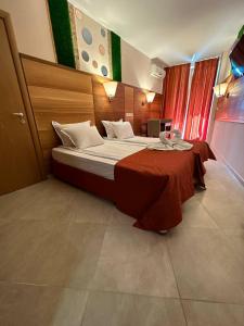 A bed or beds in a room at Briz Beach apartments - section B