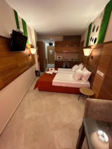 A bed or beds in a room at Briz Beach apartments - section B