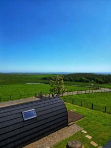 a roof of a house with a view of a field at Willow Cabin in Hexham +4 photos