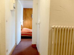 Łóżko lub łóżka w pokoju w obiekcie Appartement skis aux pieds à Tignes avec balcon, 6 couchages, proche commerces et navettes - FR-1-502-480