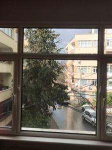 a view of a street from a window at Bright apartment in Beşiktaş / Abbasağa in Istanbul