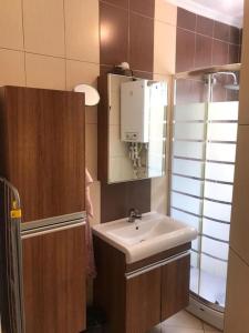 a bathroom with a sink and a mirror at Bright apartment in Beşiktaş / Abbasağa in Istanbul