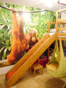 two stuffed animals on a slide in a bedroom at Casa Gibraltar in Estepona