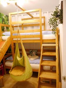 a bunk bed with a hammock in a room at Casa Gibraltar in Estepona