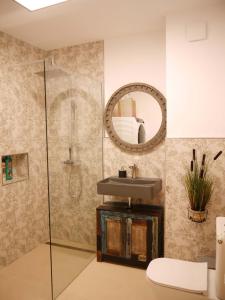 a bathroom with a sink and a mirror at Casa Gibraltar in Estepona