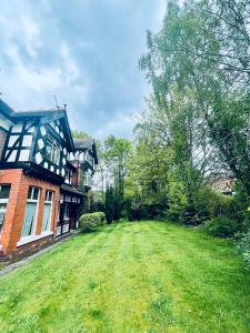 a large yard in front of a house at A wonderful room in Sale