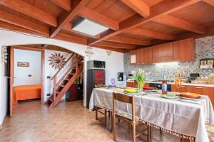 A kitchen or kitchenette at Vista Sul Pan di Zucchero - Terrazza vista mare a Nebida