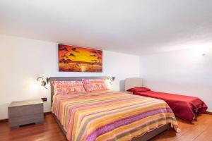 A bed or beds in a room at Vista Sul Pan di Zucchero - Terrazza vista mare a Nebida