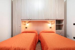 A bed or beds in a room at Vista Sul Pan di Zucchero - Terrazza vista mare a Nebida