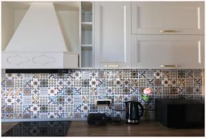 Kuchyň nebo kuchyňský kout v ubytování Luxury Seafront Suite Fabri