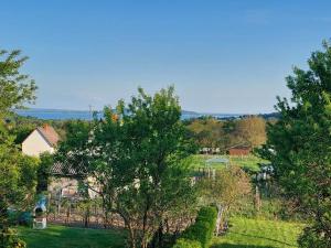 an aerial view of a house in a field with trees at HangVilla Badacsony in Badacsonytomaj