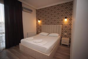 Postel nebo postele na pokoji v ubytování Hotel Irise