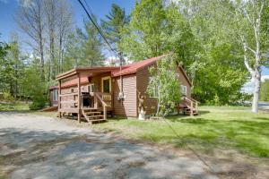a cabin in the woods with a driveway at Gorgeous Sunday River Cabin with Saltwater Hot Tub! in Newry