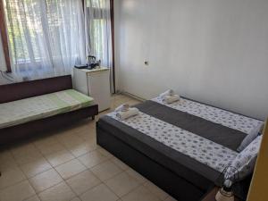 Postel nebo postele na pokoji v ubytování Цвета