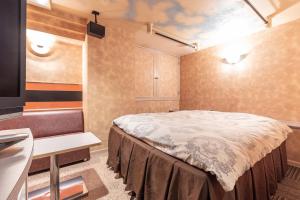 Postel nebo postele na pokoji v ubytování リトルドルフィン岐阜 -大人専用-