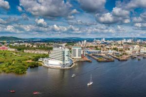 an aerial view of a river with a city at Century Central, Cardiff Bay, Modern Chic 2BR, Free Parking in Cardiff