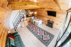 an overhead view of a living room and dining room at Casuta mea in Stulpicani