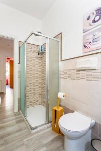 a bathroom with a shower and a toilet at E.R. Apartment in Palermo