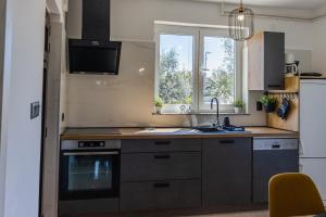 Kuchyňa alebo kuchynka v ubytovaní Apartman Luma