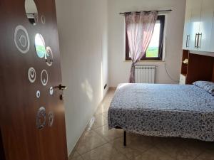 Säng eller sängar i ett rum på Villa Emilia