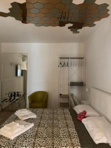 a room with a bed and a ceiling at Visavi' Luxury Room in Torre a Mare