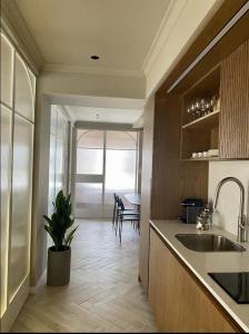 a kitchen with a sink and a dining room at 402 - GoodHouse Hillel St in Jerusalem