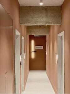 an empty hallway with two doors in a building at 402 - GoodHouse Hillel St in Jerusalem