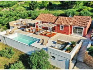an aerial view of a house with a swimming pool at Modern Mediterranean Oasis - Villa Bolka in Bol