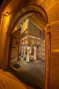 an entrance to a building with an archway in a room at Janus Cappadocia Hotel in Nevsehir