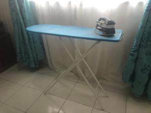 a table with a shoe sitting on top of it at AGMA Homestay in Kuantan +7 photos