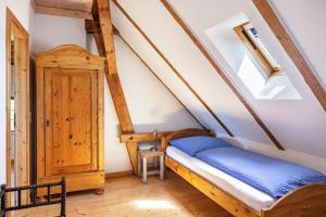 a bedroom with a bed in a attic at Forsthof Schulte in Pronstorf