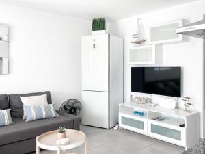 Telewizja i/lub zestaw kina domowego w obiekcie Payen Corralejo by Best Holidays Fuerteventura