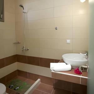 a bathroom with a sink and a shower at Villa Elista in Astris