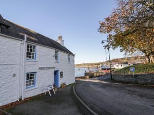 a white building on the side of a road at 30 Union Street in Kirkcudbright