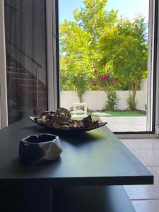 a plate of food on a table in front of a window at Males House in Malles