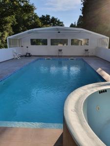 a large swimming pool in a backyard at Studio à la campagne in Sarrians