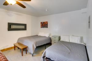 a bedroom with two beds and a couch at Lava Hot Springs Studio with Views - Walk to River in Lava Hot Springs
