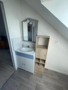 a bathroom with a sink and a mirror at Duplex 4 personnes, ARMADA 2023 in Boos