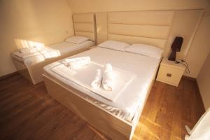 Postel nebo postele na pokoji v ubytování Hotel Irise