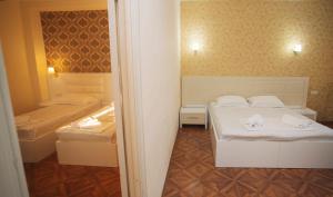 Postel nebo postele na pokoji v ubytování Hotel Irise