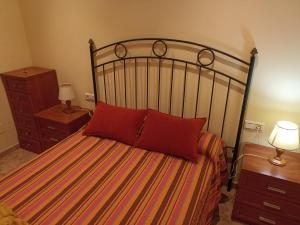 Säng eller sängar i ett rum på Garrisol
