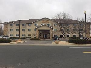 a large building with a parking lot in front of it at Quality Inn & Suites Loveland in Loveland