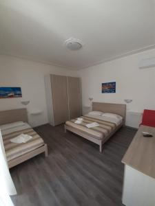 Postel nebo postele na pokoji v ubytování La Llua Alghero