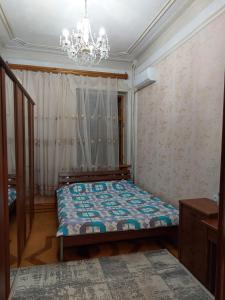 Кровать или кровати в номере Centr flat